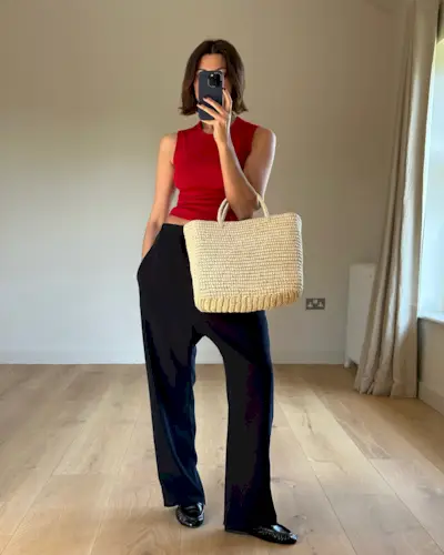 An image of @smythsisters wearing a woven leather bag.