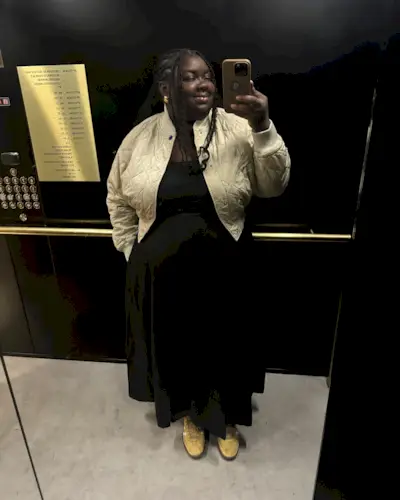 Influencer wears butter yellow sneakers.