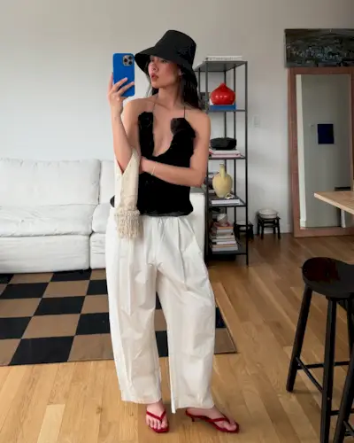 @mimixn wears red heeled flip-flops from Toteme