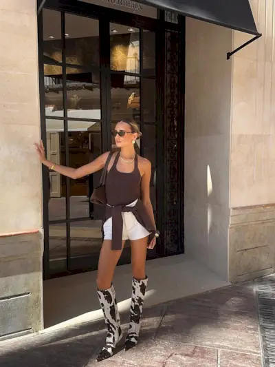 woman wearing cow print shoe outfit fall 2025