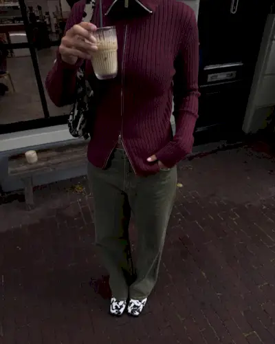 woman wearing cow print shoe outfit fall 2025