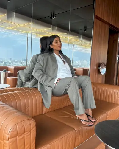 Monikh Dale wearing heeled flip-flops