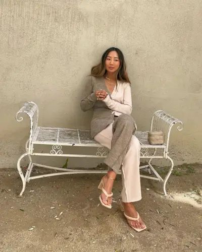 Aimee Song wearing a knitted matching set with thong heeled sandals.