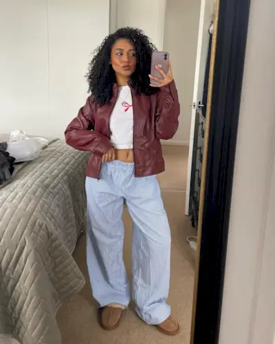 Influencer wears a burgundy leather jacket