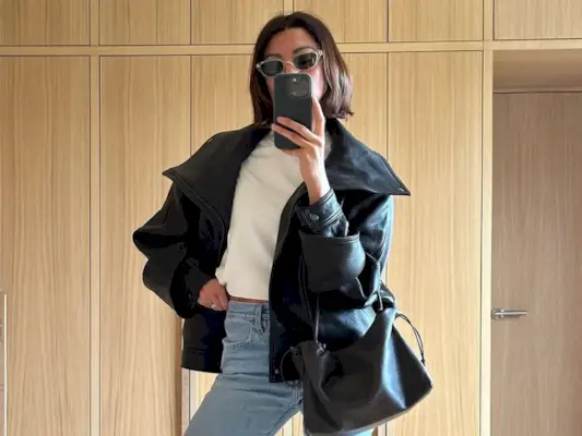 woman wearing slim jeans with leather jacket and ballet flats