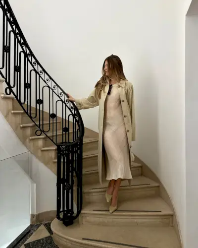 An image of @styledsara wearing a sheer white midi dress with pointed toe shoes.