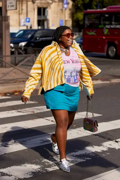most popular chanel bags shown in a street style photo of a woman carrying a chanel bag