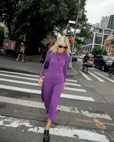 @lucywilliams02 wearing a purple dress and black loafers