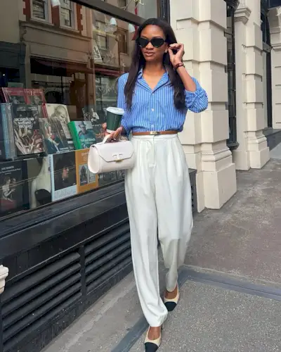 @symphonyofsilk wears cream satin trousers