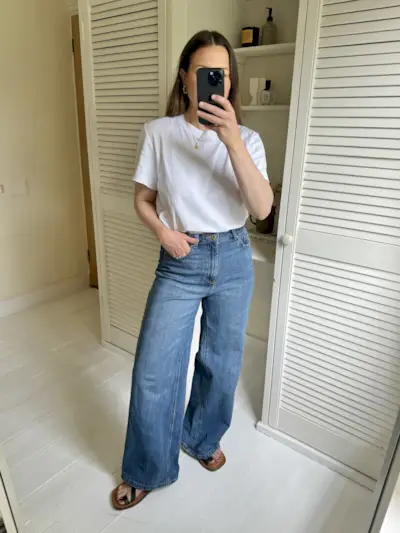 Woman tries on M&S Wide Leg Jeans