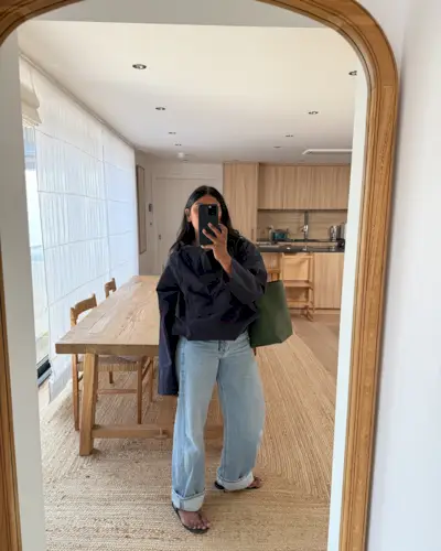 An image of @monikh wearing cuffed wide-leg trousers with a windbreaker jacket and rope accessories.