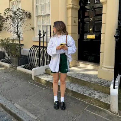 An influencer wearing adidas shorts.