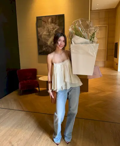 Woman wearing jeans with pointed peep-toe heels 2025.