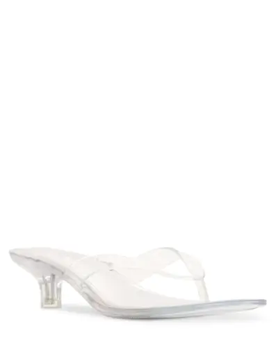 An influencer wearing clear heels.