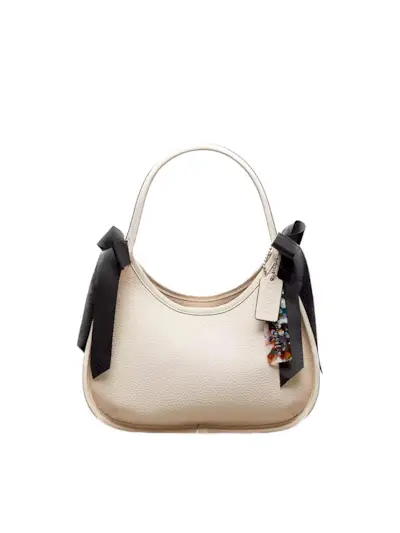 Coach bag with bows on the handle