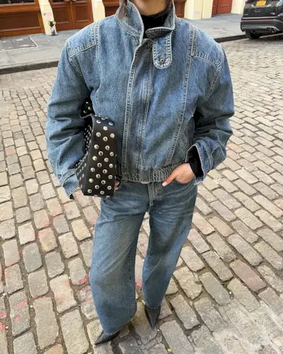 Woman wearing denim on denim outfit fall 2025.