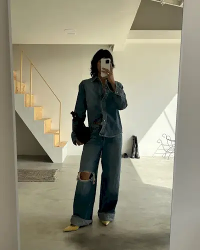 Woman wearing denim on denim outfit fall 2025.