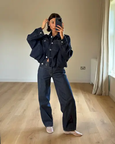 Woman wearing denim on denim outfit fall 2025.