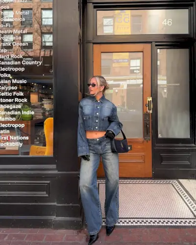 Woman wearing denim on denim outfit fall 2025.