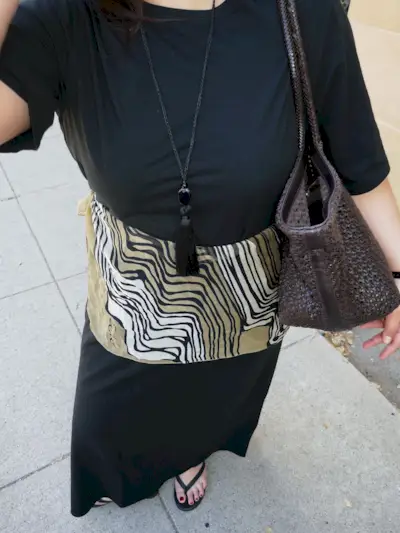 An image of @marina_torres wearing a scarf belt, one of the biggest summer accessories.