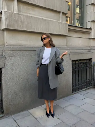 woman wearing fall skirt outfit 2025