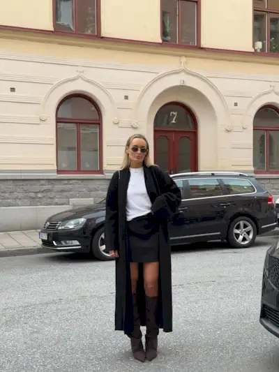 woman wearing fall skirt outfit 2025