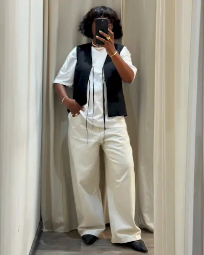 French influencer wearing a vest-white tee, and cream jeans