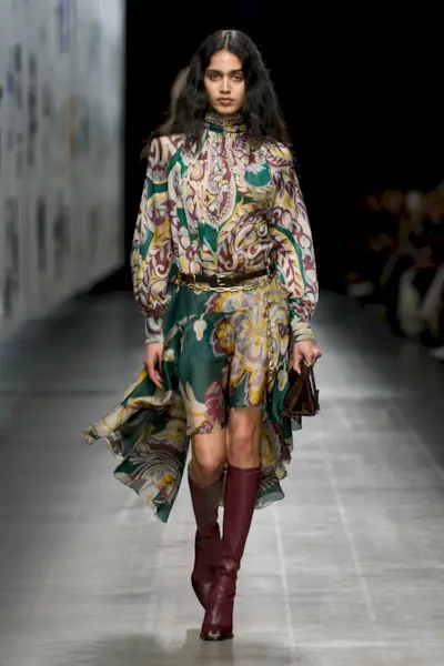 A model wears burgundy boots on Etro's autumn/winter 2025 runway