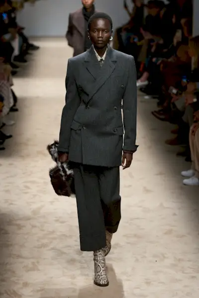 A model wears brown boots on Tod's autumn/winter 2025 runway