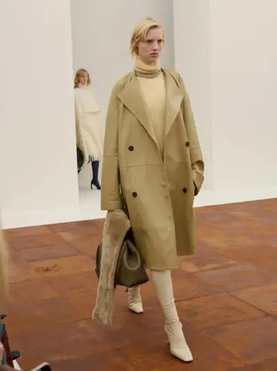 A model wears sock boots on Toteme's autumn/winter 2025 runway