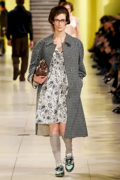 An image of gingham on the Miu Miu AW25 runway.