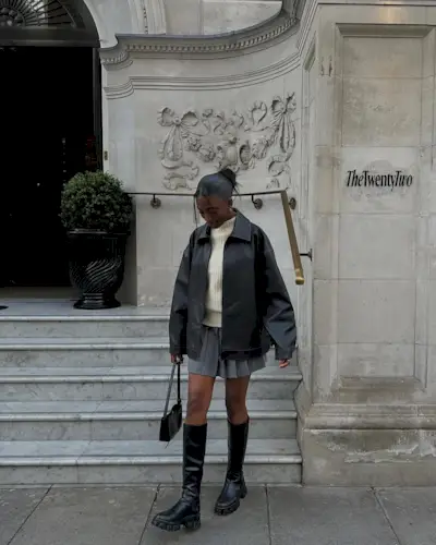 @_livmadeline wears a leather bomber jacket