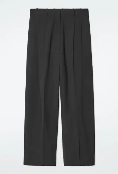An image of COS trousers, a staple of preppy fashion.