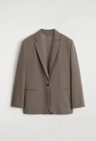 An image of a COS blazer, a staple of preppy fashion.