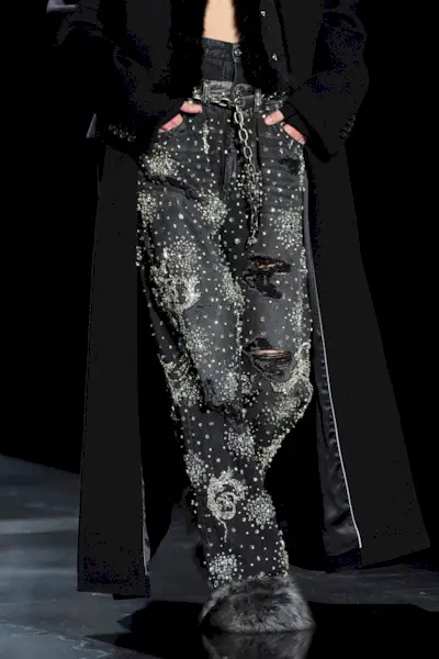 Model wears embellished jeans on the Dolce & Gabbana runway