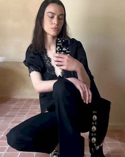 An image of @alexachung wearing a musical festival outfit.