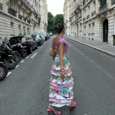 Influencer wears a ruffle skirt.