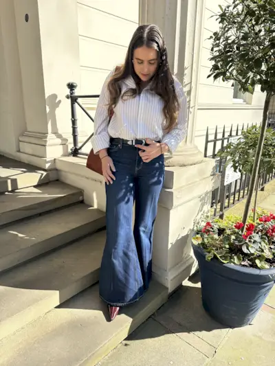 An image of Mommy's Reviews SEO Writer Ava Gilchrist wearing one of the best flared jeans.