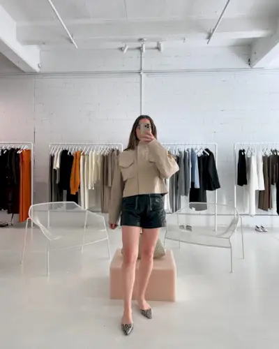 An image of Mommy's Reviews UK SEO Writer Ava Gilchrist wearing one of the biggest short trends for 2025.