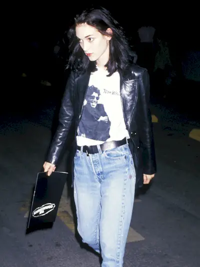 Woman wearing a leather blazer in the '90s.