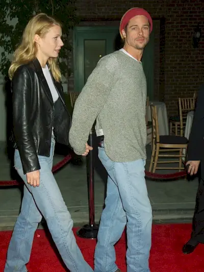 Brad Pitt wearing baggy jeans and a beanie in the '90s.