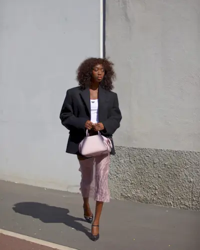 woman in a blazer and sheer skirt