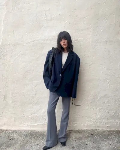 woman in a blazer and flare pants