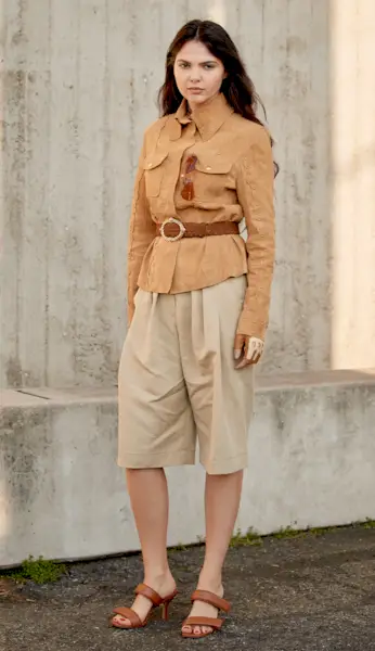 woman wearing jacket and bermuda shorts