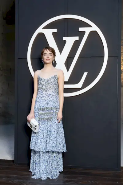 Emma Stone wears a tiered maxi dress to the Louis Vuitton Cruise 2026 show in Avignon