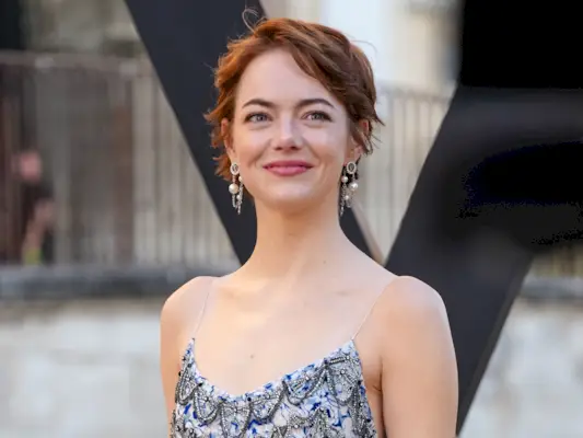 Emma Stone looks away from the camera at the Louis Vuitton Cruise 2026 show in Avignon