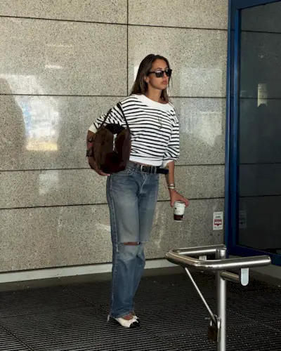 @hannamw wearing a striped YSL top and jeans.