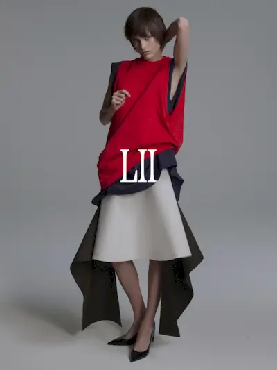 A photo of a model wearing a Lii red top, gray dress, and white skirt. Text says 'Lii in white capital serif letters.