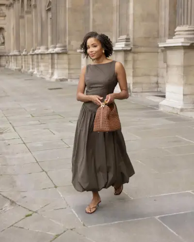 Influencer wears a basque waist dress.