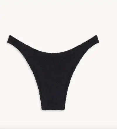 woman wearing triangle bikini top walking dogs